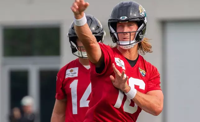Jacksonville Jaguars quarterback Trevor Lawrence, (16) throws a pass during practice at the team's NFL football training camp, Wednesday, July 29, 2026, in Jacksonville, Fla. (AP Photo/Kelly Jordan)