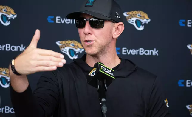 Jacksonville Jaguars head coach Liam Coen talks to the media during practice at the team's NFL football training camp, Wednesday, July 29, 2026, in Jacksonville, Fla. (AP Photo/Kelly Jordan)