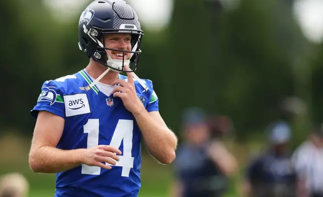 Seattle Seahawks quarterback Sam Darnold smiles during the NFL football team's training camp, Sunday, July 26, 2026, in Renton, Wash. (AP Photo/Lindsey Wasson)