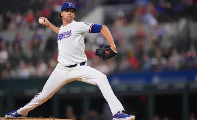Texas Rangers starting pitcher Jacob deGrom throws to the Los Angeles Angels during the first inning of a baseball game, Tuesday, July 7, 2026, in Arlington, Texas. (AP Photo/Julio Cortez)