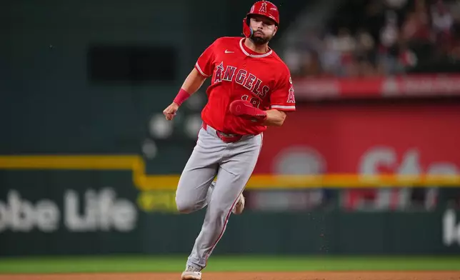 Los Angeles Angels' Nolan Schanuel runs the bases while scoring on a double by Jorge Soler against the Texas Rangers during the first inning of a baseball game, Tuesday, July 7, 2026, in Arlington, Texas. (AP Photo/Julio Cortez)