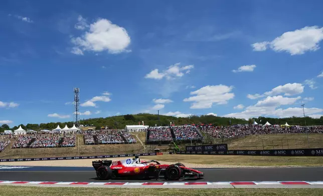 Ferrari driver Charles Leclerc of Monaco steers his car during the third free practice ahead of Sunday's Formula One Hungarian Grand Prix auto race, at the Hungaroring racetrack in Mogyorod, near Budapest, Hungary, Saturday, July 25, 2026. (AP Photo/Darko Vojinovic)
