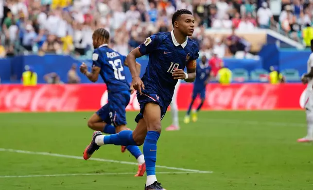 France's Kylian Mbappe (10) celebrates scoring his side's first goal during the World Cup third-place playoff soccer match between France and England in Miami Gardens, Fla., Saturday, July 18, 2026. (AP Photo/Rebecca Blackwell)