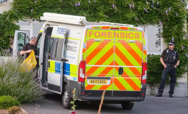 Police outside the house of former lawmaker Ann Widdecombe, in Haytor, England, Friday July 10, 2026, after she was found dead in her home on Thursday with serious injuries. (Matt Keeble/PA via AP)
