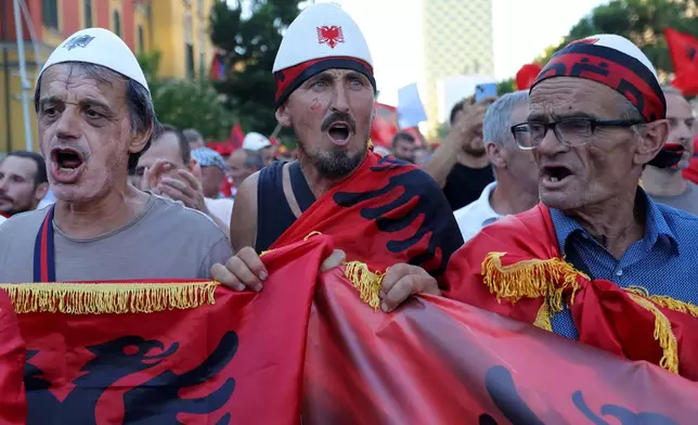 Protesters chant slogans during a rally against plans for a luxury construction project linked to U.S. President Donald Trump's son-in-law, Jared Kushner, in Tirana, Albania, Saturday, July 4, 2026.(AP Photo/Hameraldi Agolli)