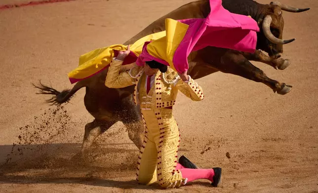 Spanish bullfighter Saúl Jiménez Fortes performs during a bullfight at the San Fermin festival in Pamplona, northern Spain, Sunday, July 12, 2026. (AP Photo/Miguel Oses)
