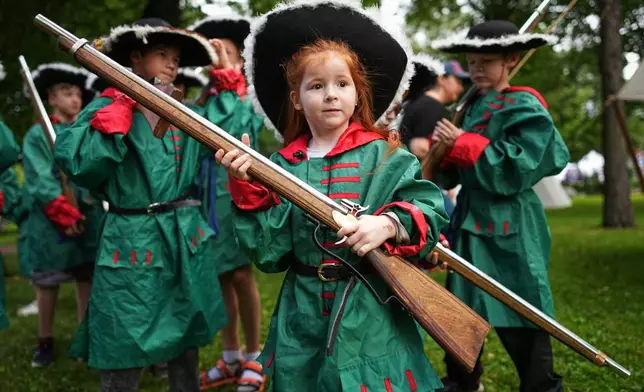 Children attend a historical festival marking the Day of Military Glory in St. Petersburg, Russia, Friday, July 10, 2026. (AP Photo/Dmitri Lovetsky)