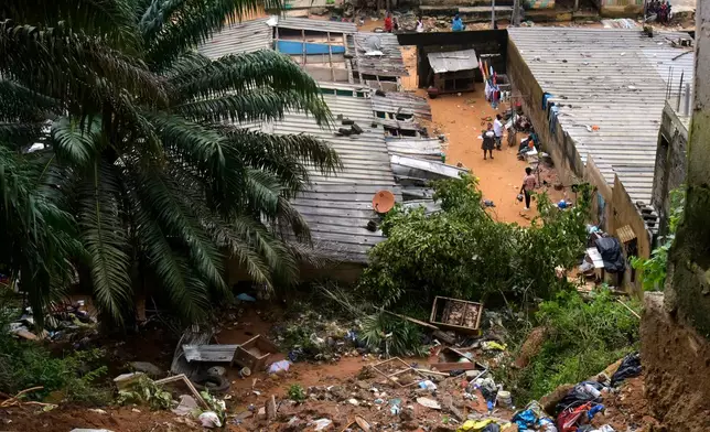 A view of the houses damaged by landslides in an informal settlement of Attecoube, in Abidjan, Ivory Coast, Tuesday, June 30, 2026. (AP Photo/Diomande Ble Blonde)