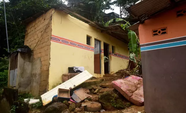 A house damaged by landslides in an informal settlement of Attecoube, in Abidjan, Ivory Coast, Tuesday, June 30, 2026. (AP Photo/Diomande Ble Blonde)