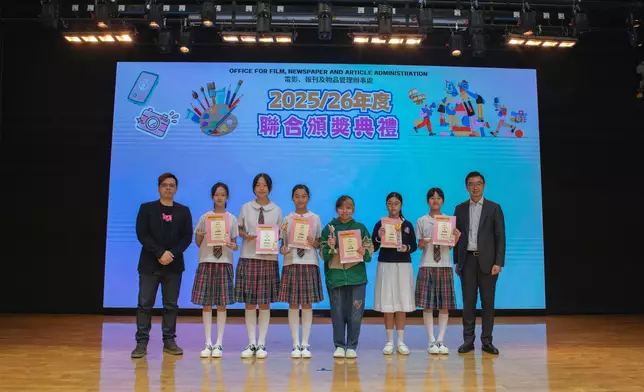 The Office for Film, Newspaper and Article Administration held the prize presentation ceremony for the "Healthy Student Video Contest 2026", the "'Control of Obscene and Indecent Articles Ordinance' Slogan and Colouring Competition 2025-26" and the "Healthy Mobile App Sticker Design Competition" today (July 4). Photo shows the guests with the winners of the "Healthy Mobile App Sticker Design Competition". Source: HKSAR Government Press Releases