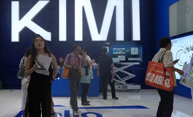 Visitors at the booth for Chinese AI Startup Moonshot's Kimi K3 during the World AI Conference in Shanghai, China on July 17, 2026. (AP Photo/Ng Han Guan)