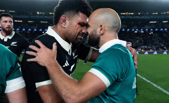 New Zealand's Ardie Savea, left, and Ireland's Jamison Gibson-Park, do a hongi, a traditional Maori greeting, after their Nations Championship rugby international test match in Auckland, New Zealand, Saturday, July 18, 2026. (Brett Phibbs/Photosport via AP)