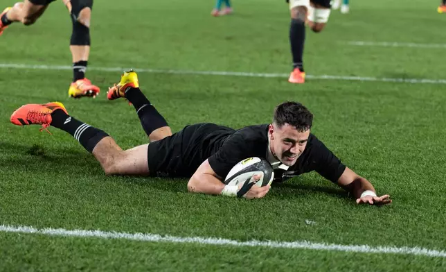 New Zealand's Will Jordan scores a try against Ireland during their Nations Championship rugby international test match in Auckland, New Zealand, Saturday, July 18, 2026. (Brett Phibbs/Photosport via AP)