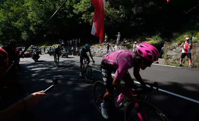 Ecuador's Richard Carapaz climbs Alpe d'Huez during the nineteenth stage of the Tour de France cycling race with start in Gap and finish in Alpe d'Huez, France, Friday, July 24, 2026. (AP Photo/Mosa'ab Elshamy)