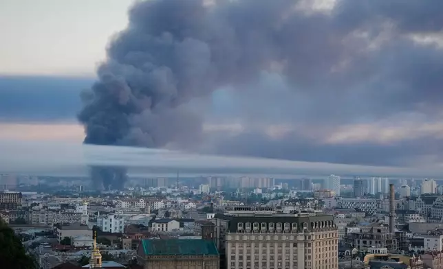 Smoke rises over the city center after a Russian attack on Kyiv, Ukraine, Thursday, July 2, 2026. (AP Photo/Efrem Lukatsky)