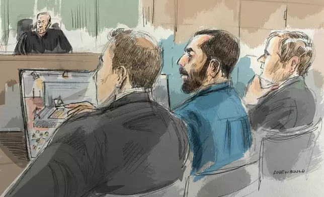 In this courtroom sketch, Hadi Matar, center, sits in federal court during his terrorism trial for his alleged attack on Salman Rushdie, Wednesday, July 22, 2026, in Buffalo, N.Y. (Alexandra Newbould via AP)