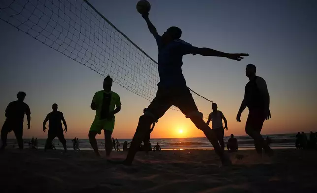 Palestinians spend the day on the beach of the Mediterranean Sea in Zawaida, central Gaza Strip, Friday, July 17, 2026. (AP Photo/Abdel Kareem Hana)