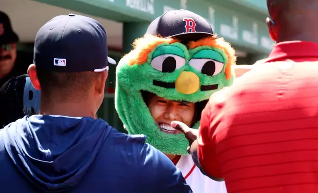 Boston Red Sox designated hitter Masataka Yoshida celebrates in the dugout his home run during the fourth inning of the first baseball game of a doubleheader against the Tampa Bay Rays, Friday, July 17, 2026, in Boston. (AP Photo/Mark Stockwell)