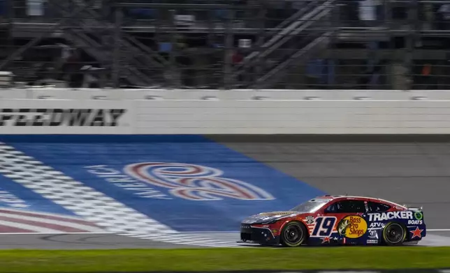 Chase Briscoe (19) crosses the finish line to win a NASCAR Cup Series Eero 400 auto race at Chicagoland Speedway in Joliet, Ill., Sunday, July 5, 2026. (AP Photo/Nam Y. Huh)