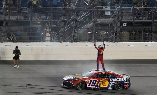 Chase Briscoe (19) celebrates after winning a NASCAR Cup Series Eero 400 auto race at Chicagoland Speedway in Joliet, Ill., Sunday, July 5, 2026. (AP Photo/Nam Y. Huh)