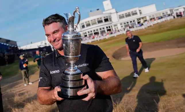 Ryan Fox of New Zealand poses with the Claret Jug trophy after winning the British Open Golf championships at Royal Birkdale golf club, in Southport, England, Sunday, July 19, 2026. (AP Photo/David Goldman)