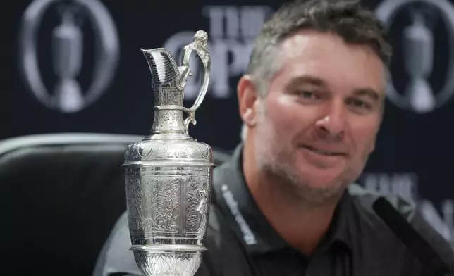 Ryan Fox of New Zealand speaks at a press conference with the Claret Jug trophy after winning the British Open Golf championships at Royal Birkdale golf club, in Southport, England, Sunday, July 19, 2026. (AP Photo/Peter Morrison)