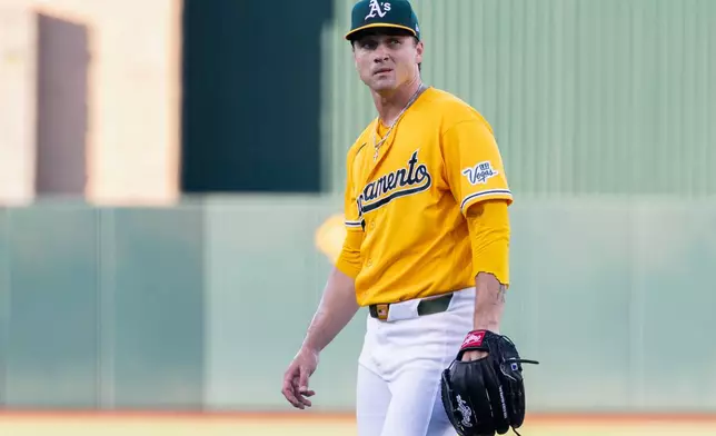Athletics pitcher J.T. Ginn walks to the dugout during the first inning of a baseball game against the Washington Nationals Saturday, July 18, 2026, in West Sacramento, Calif. (AP Photo/Sara Nevis)