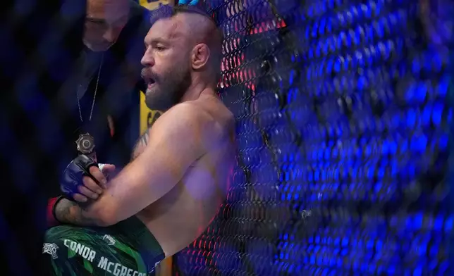 Conor McGregor reacts after losing to Max Holloway in a welterweight fight at the UFC 329 mixed martial arts event Saturday, July 11, 2026, in Las Vegas. (AP Photo/John Locher)
