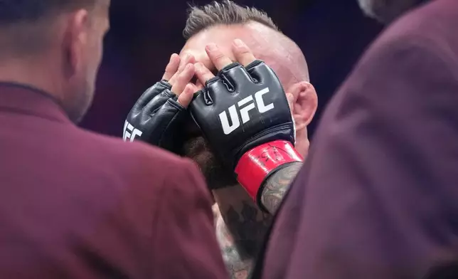 Conor McGregor reacts after losing to Max Holloway in a welterweight fight at the UFC 329 mixed martial arts event Saturday, July 11, 2026, in Las Vegas. (AP Photo/John Locher)