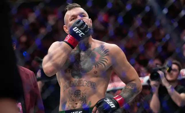 Conor McGregor reacts after losing to Max Holloway in a welterweight fight at the UFC 329 mixed martial arts event Saturday, July 11, 2026, in Las Vegas. (AP Photo/John Locher)