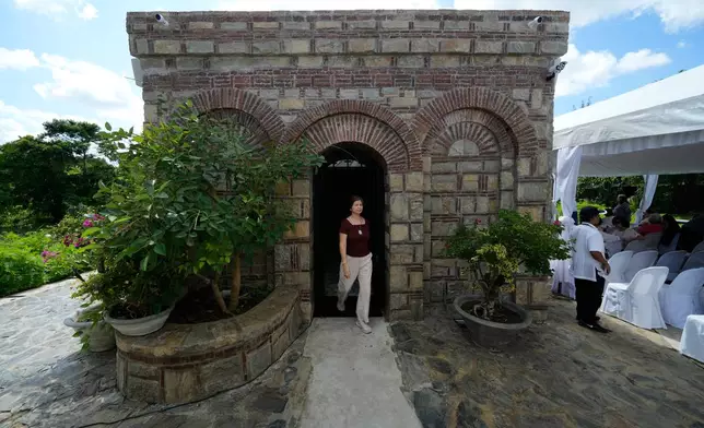 A Catholic devotee walks outside the Ephesus House, a replica of the House of the Virgin Mary in Ephesus, Turkey, at Alfonso town, Cavite province, Philippines on July 16, 2026. (AP Photo/Aaron Favila)