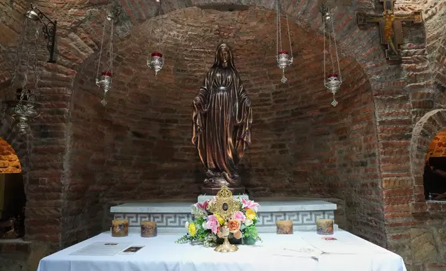 A statue of Mary modeled after the one in Turkey, alongside a relic said to be from her veil inside the Ephesus House, a replica of the House of the Virgin Mary in Ephesus, Turkey, at Alfonso town, Cavite province, Philippines on July 16, 2026. (AP Photo/Aaron Favila)