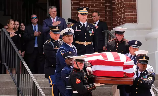 The casket of the late Sen. Lindsey Graham, R-S.C., is carried out of First Baptist Church in Columbia, S.C., following a funeral service, Wednesday, July 29, 2026. (AP Photo/Gerald Herbert)
