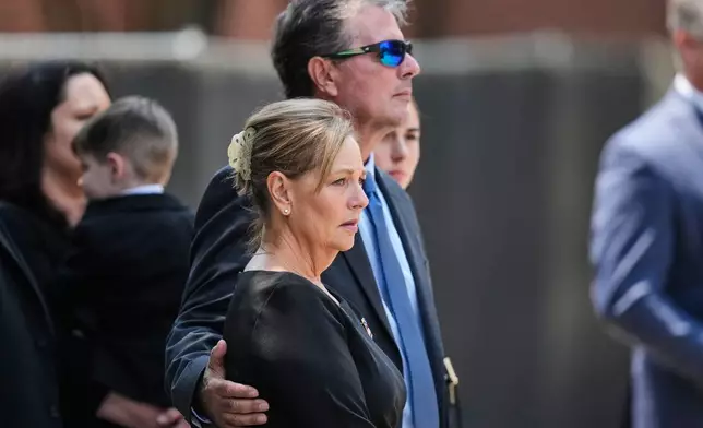 Sen. Darline Graham, R-S.C., the sister of the late Sen. Lindsey Graham, R-S.C., looks on as her brother's casket is carried out of First Baptist Church in Columbia, S.C., following a funeral service, Wednesday, July 29, 2026. (AP Photo/Gerald Herbert)