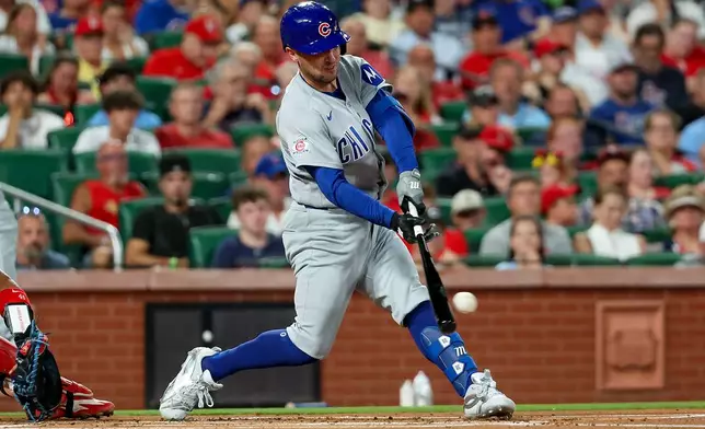 Chicago Cubs' Alex Bregman hits an RBI double during the first inning of a baseball game against the St. Louis Cardinals, Monday, July 27, 2026, in St. Louis. (AP Photo/Scott Kane)