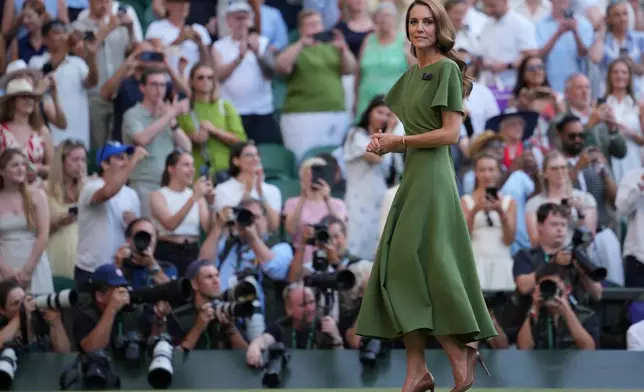 Britain's Kate Princess of Wales walks from Center Court after presenting the trophies for the men's singles final at Wimbledon Tennis Championships in London, Sunday, July 12, 2026. (AP Photo/Kin Cheung)