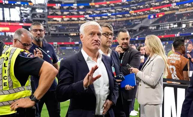 France head coach Didier Deschamps leaves the pitch at the the end of the World Cup semifinal soccer match between France and Spain in Arlington, Texas, near Dallas, Tuesday, July 14, 2026. (AP Photo/Ashley Landis)