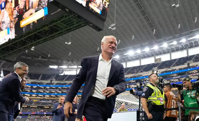 France head coach Didier Deschamps smiles on to the pitch before the World Cup semifinal soccer match between France and Spain in Arlington, Texas, near Dallas, Tuesday, July 14, 2026. (AP Photo/Ashley Landis)