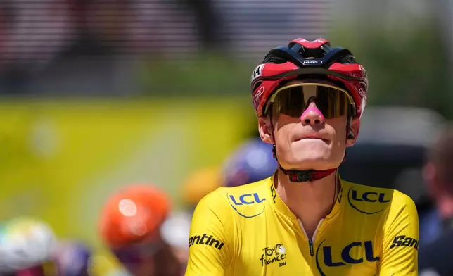 Denmark's Jonas Vingegaard, wearing the overall leader's yellow jersey, during the second stage of the Tour de France cycling race over 168.5 kilometers (104.3 miles) with start in Tarragona and finish in Barcelona, Spain, Sunday, July 5, 2026. (AP Photo/Thibault Camus)