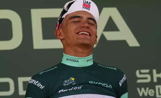 Mexico's Isaac Del Toro wearing the best sprinter's green jersey celebrates on the podium after winning the second stage of the Tour de France cycling race with start in Tarragone and finish in Barcelona, Spain, Sunday, July 5, 2026. (AP Photo/Thibault Camus)