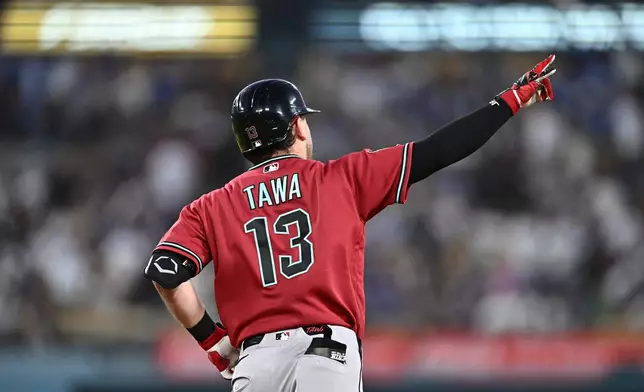 Arizona Diamondbacks' Tim Tawa gestures after hitting a home run during the fourth inning of a baseball game against the Los Angeles Dodgers, Friday, July 10, 2026, in Los Angeles. (AP Photo/William Liang)