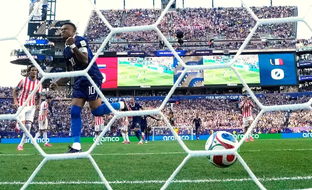 France's Kylian Mbappe (10) celebrates after scoring a goal from the penalty spot during the World Cup round of 16 soccer match between Paraguay and France in Philadelphia, Saturday, July 4, 2026. (AP Photo/Matt Slocum)