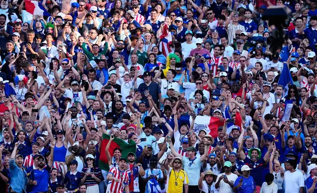 Fans react after France's Kylian Mbappe scored his side's opening goal against Paraguay during the World Cup round of 16 soccer match in Philadelphia, Saturday, July 4, 2026. (AP Photo/Petr David Josek)