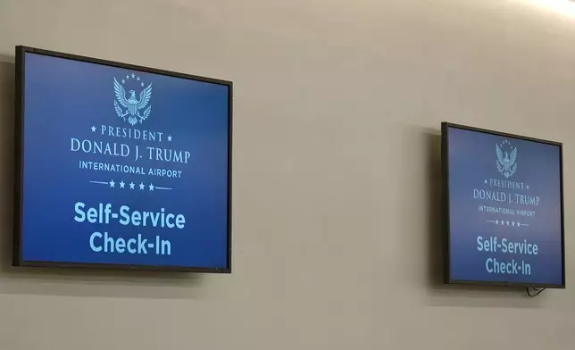 A monitor at a check-in counter displays the name of the rebranded Donald J. Trump International Airport in West Palm Beach, Fla., Thursday, July 9, 2026. (AP Photo/Cody Jackson)