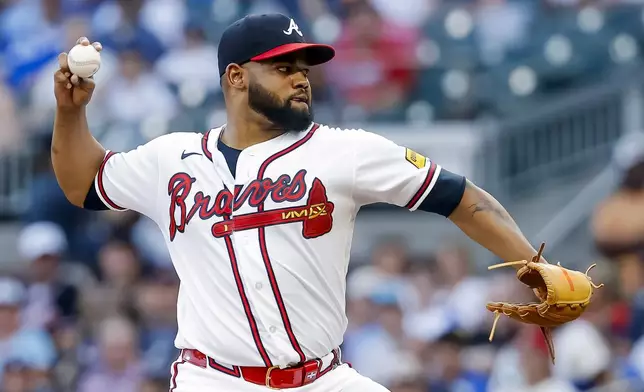 Atlanta Braves pitcher Reynaldo López delivers to a New York Mets batter during the first inning of a baseball game, Monday, July 6, 2026, in Atlanta. (AP Photo/Erik S. Lesser)
