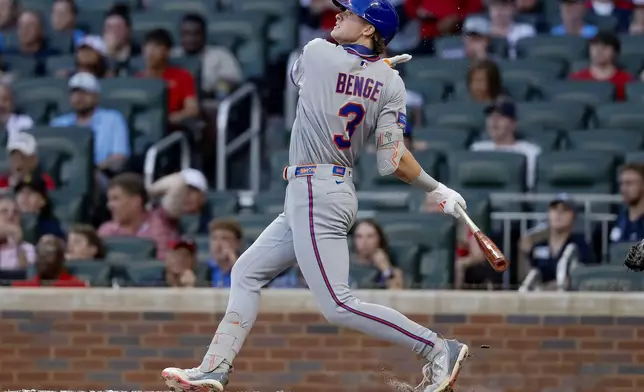 New York Mets' Carson Benge follows through on a solo home run against the Atlanta Braves during the second inning of a baseball game, Monday, July 6, 2026, in Atlanta. (AP Photo/Erik S. Lesser)