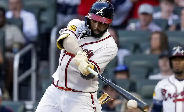 Atlanta Braves' Michael Harris II hits an RBI single against the New York Mets during the second inning of a baseball game, Monday, July 6, 2026, in Atlanta. (AP Photo/Erik S. Lesser)