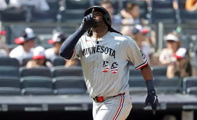 Minnesota Twins designated hitter Josh Bell reacts after hitting a solo home run during the seventh inning of a baseball game against the New York Yankees, Saturday, July 4, 2026, in New York. (AP Photo/Adam Hunger)