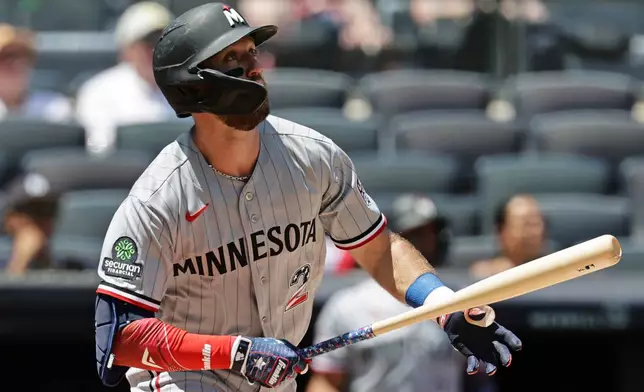 Minnesota Twins' Kody Clemens watches his two-run home run during the first inning of a baseball game against the New York Yankees, Saturday, July 4, 2026, in New York. (AP Photo/Adam Hunger)