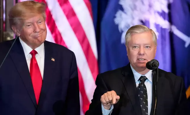 FILE - Former President Donald Trump listens as Sen. Lindsey Graham, R-S.C., speaks at a campaign event at the South Carolina Statehouse, Jan. 28, 2023, in Columbia, S.C. (AP Photo/Alex Brandon, File)